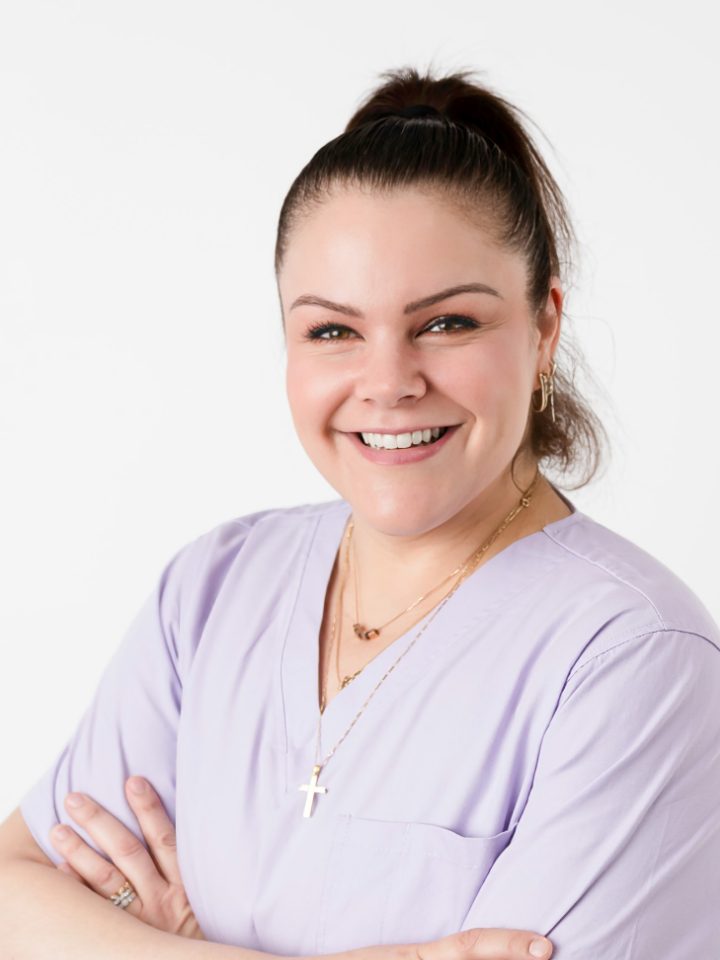 Nohelia (Natalie), endorsed midwife, in lilac scrubs