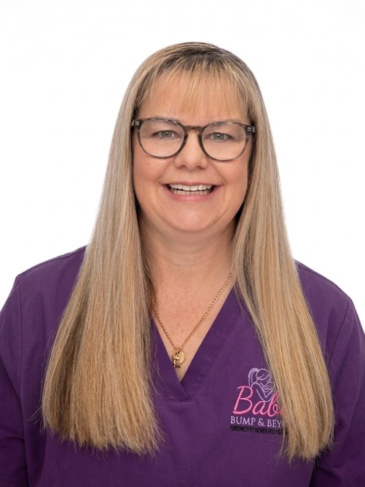 Suzie, endorsed midwife, in purple Babee Bump & Beyond scrubs